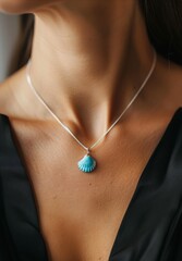 beads with shell on neck close up.