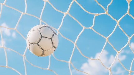 Ball swishing through net, against a perfect sky.