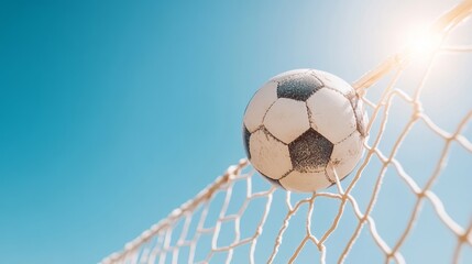 Ball through the net, clear sky captured in the moment.