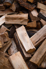 Chopped firewood in a large pile. The prepared power source is ready for combustion.	