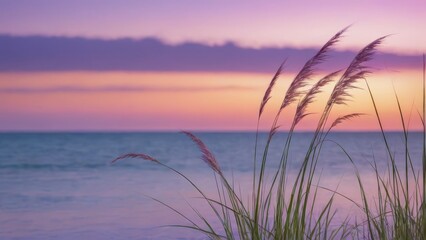 Naklejka premium A serene coastal scene at sunset with grass swaying by the water.