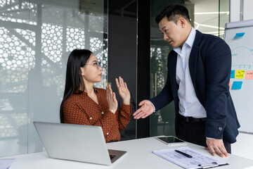 Sexual Harassment in the Workplace Asian Male Boss Harassing and Molesting a Female Subordinate Inside the Office at the Workplace.