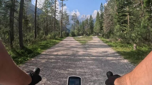 Cyclist rides in the dolomites in a beautiful environment