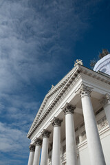 Low angle view of details of the neoclassical style architecture of the cathedral of Helsinki against cloudy sky