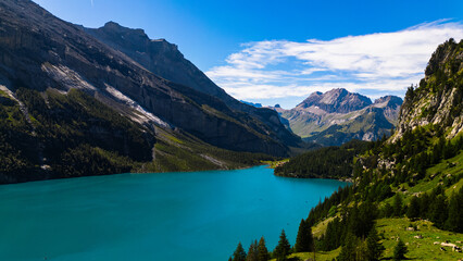 Perfect summer day at alpine lake in the swiss mountains (Oeschinensee)