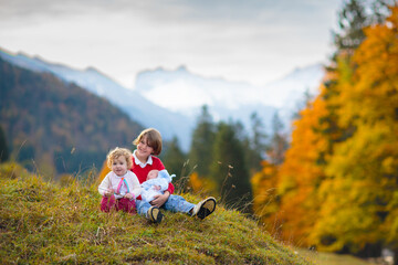 Family with kids hiking in the mountains