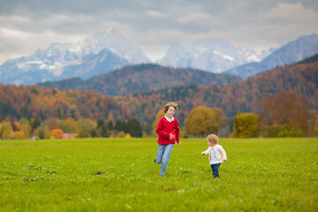 Family with kids hiking in the mountains