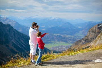 Fototapeta premium Family with kids hiking in the mountains