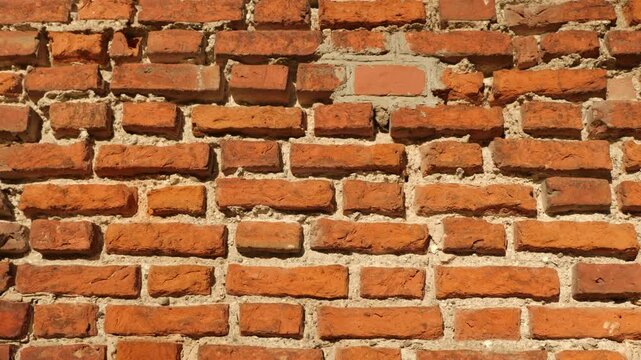 Vibrant orange bricks with intricate details and shadows.