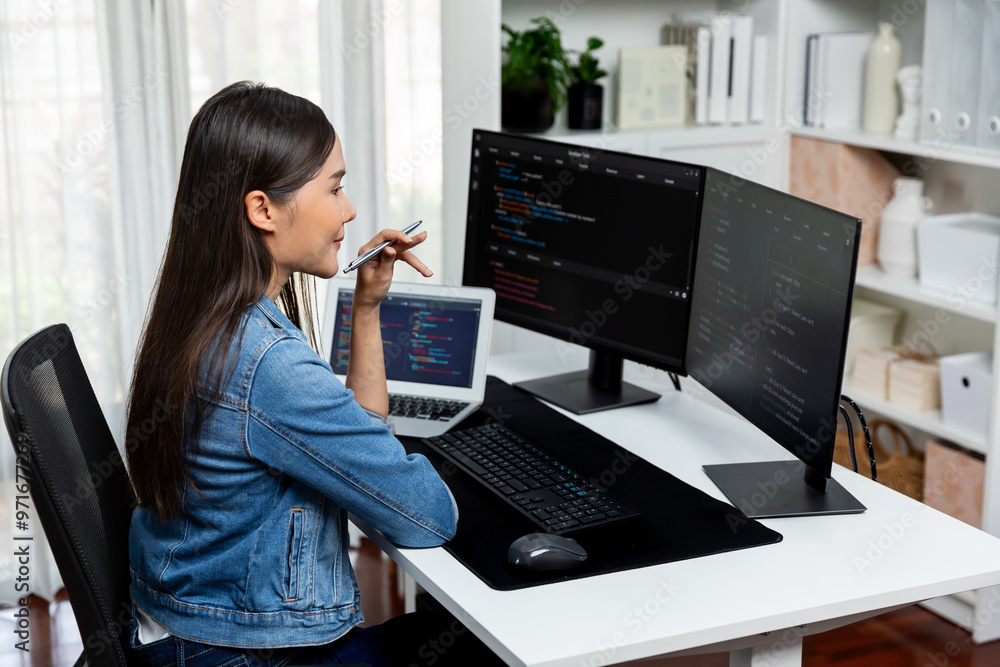 Poster young asian it developer looking online information on pc for beautiful pose with coding program dat