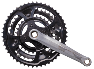 Heavily worn bicycle sprocket and crank on an isolated background.
