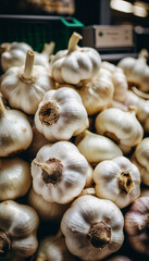 A supermarket counter features fresh, large garlic bulbs arranged attractively, enticing customers with their vibrant appearance and rich aroma. Shoppers browse for culinary inspiration. Generative AI