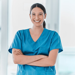 Portrait, nurse and happy woman with arms crossed for healthcare career, pride and service in...