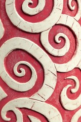 Elegant Swirl Design on Textured Red Background