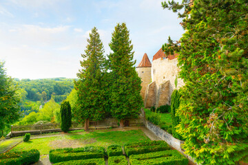 Naklejka premium View from the fortified walls of the Bavarian countryside and Johannite Tower in the medieval city of Rothenburg ob der Tauber, Germany. 