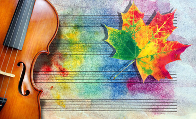 violin on the background of music paper in watercolor stains and colorful autumn maple leaf....