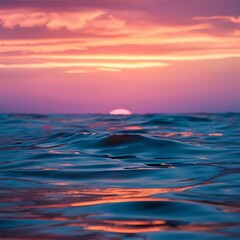 Fototapeta premium Sunset on the ocean. beautiful bright sky, reflection in water, waves.