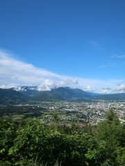 green countryside in the austrian alps with houses and trees
