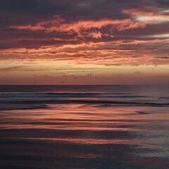 Obraz premium Sunset on the ocean. beautiful bright sky, reflection in water, waves.