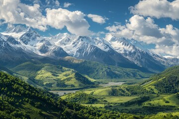 A breathtaking panorama of snow-capped peaks towering above a vast expanse of green valleys and forests