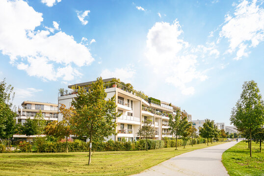 Residential area with ecological and sustainable green residential buildings, low-energy houses with apartments and green courtyard