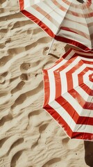 Closeup of beach umbrellas with bright stripes, standing tall on the sand..