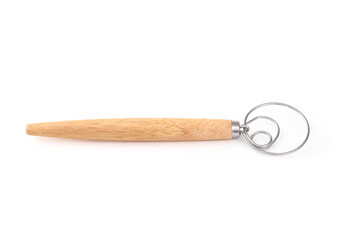 Isolated dough whisk. Side view of handheld wooden whisk Baking tool to blend and mix bread dough or batter. Also known as Danish dough whisk or brodpisker. Selective focus. White background.