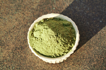 Barley grass powder in a bowl