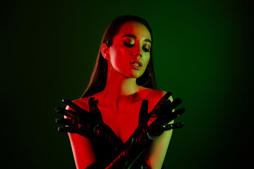 Photo of gorgeous feminine model girl latex glove crossed arms cover body bright neon lights