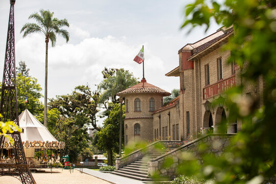Orizaba, Veracruz, Mexico - July 14, 2022: Cloudy sun shines on the historic Castillo Mier Y Pesado, a castle in downtown Orizaba.