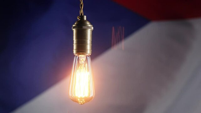 Glowing Edison light bulb on Czech Republic flag background. Electricity price, bills, energy crisis, raising tariffs.