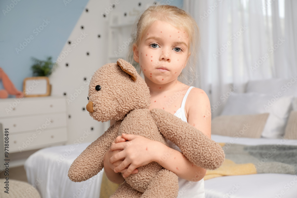 Canvas Prints Little girl ill with chickenpox holding toy bear in bedroom