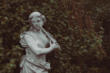 statue playing a flute © Whitney