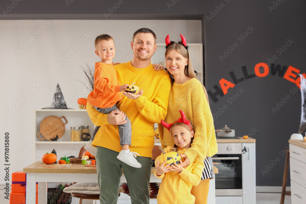 Wall mural happy family with halloween pumpkins in kitchen