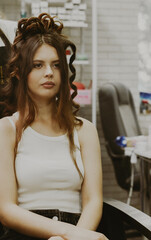 Portrait of a young girl at the hairdresser.