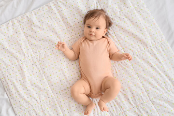 Cute little baby in bodysuit lying on blanket, top view