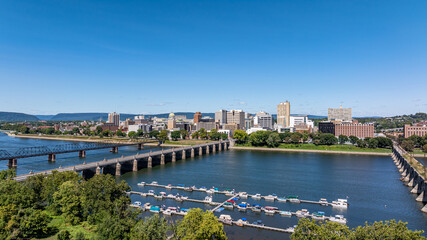 Fototapeta premium Late summer, early fall aerial, drone, photo of the Harrisburg Pennsylvania skyline and the Susquehanna River. September 2024.