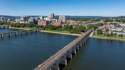 Obraz premium Late summer, early fall aerial, drone, photo of the Harrisburg Pennsylvania skyline and the Susquehanna River. September 2024.