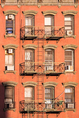 Obraz premium old iron fire escape rescue ladders at old houses