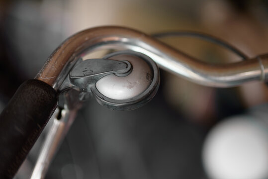 Close-up of bicycle bell and handlebars