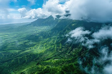 Aerial view of lush green mountains with clouds. This photo is perfect for travel, nature, and landscape projects.