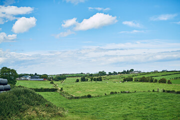 Blue sky, countryside and nature with landscape, farm and environment for agriculture Empty, grass...