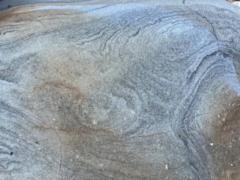 Pale blue and grey pattern in granite creating an abstract design.