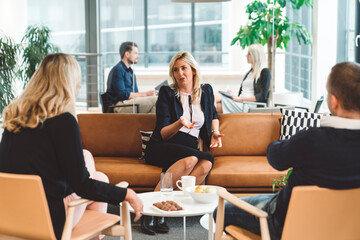 Modern office workspace - Meetings happening at the same time in offices with glass walls