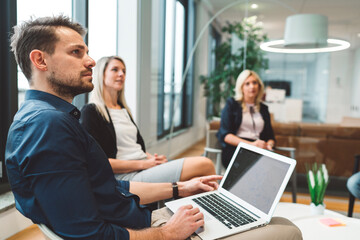 Close-up of focused employees, business people listening to their boss
