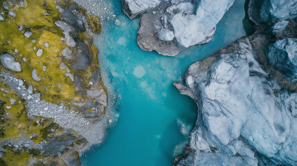Turquoise glacier water flowing between mountain ridges