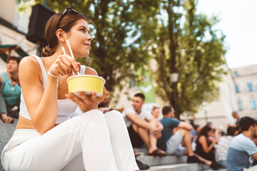 Woman enjoying her lunch at local food market
