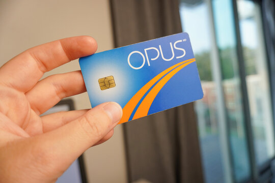 Montreal; Quebec - Canada: July 29; 2024 - Hand holding Opus Card. STM montreal metro card.