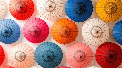 Artistic pattern of colorful umbrellas floating against a white-cloud background, creating a beautiful and dynamic visual experience