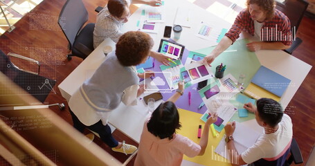 Image of financial data processing over diverse business people in office